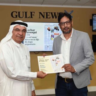 Receiving the Gulf News editorial award for Best Story from Editor in Chief Abdul Hamid Ahmed